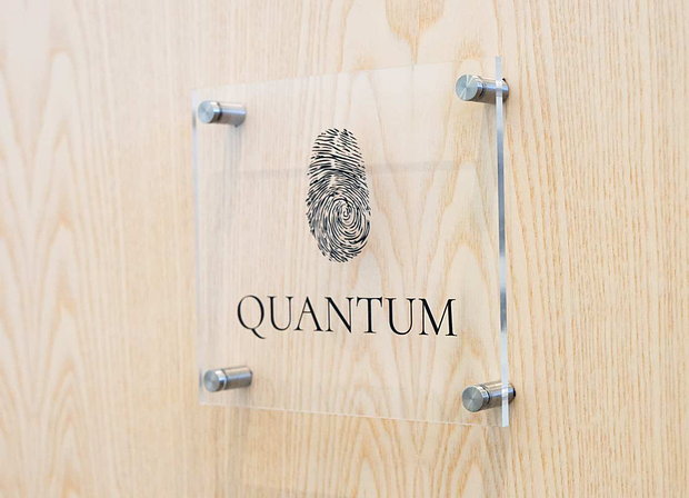 Acrylic sign on a wooden panel wall