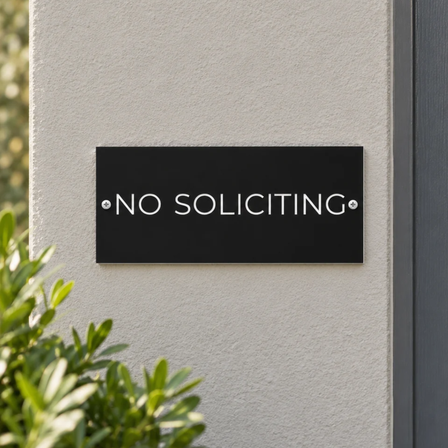 A do not disturb sign mounted on wall