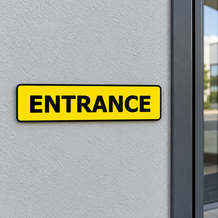 Yellow entrance sign in engraved plastic